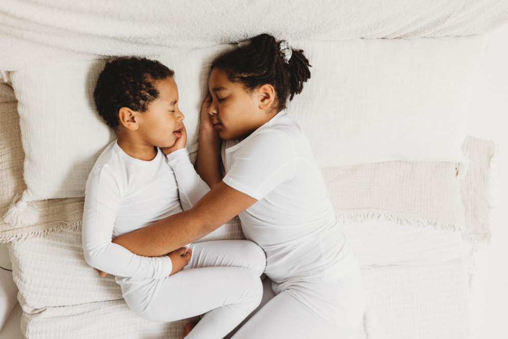 child wearing HappySkin white cooling summer eczema pyjamas for babies and children with atopic dermatitis