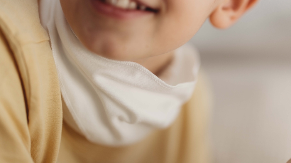 Close-up of hypoallergenic DreamSkin fabric on HappySkin child neck wrap for sensitive skin